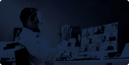 Blue-tinted background of a man watching a webinar